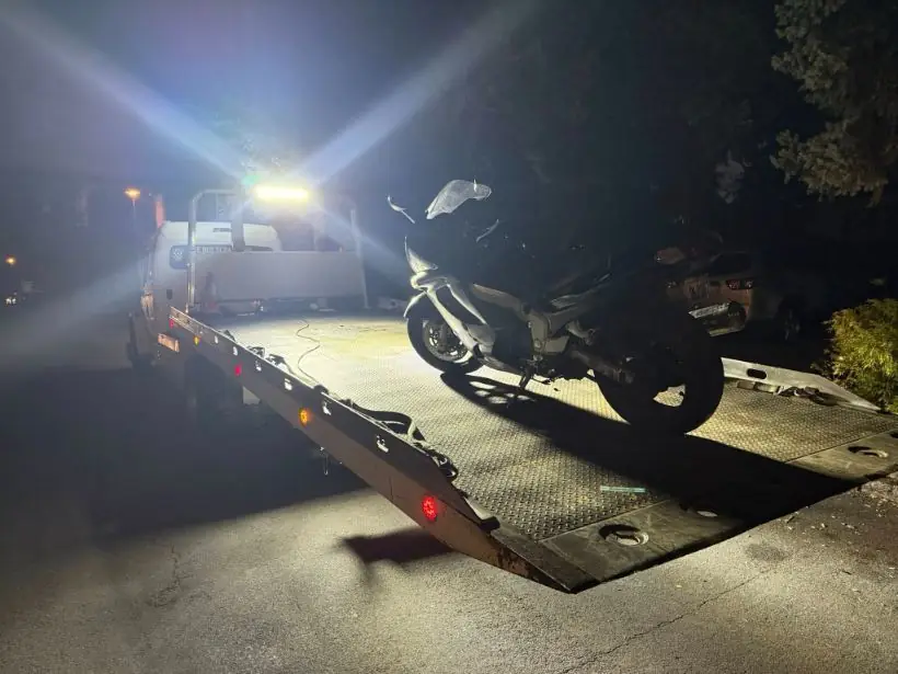 Zee's Towing motorcycle tow at night in Portland, Oregon